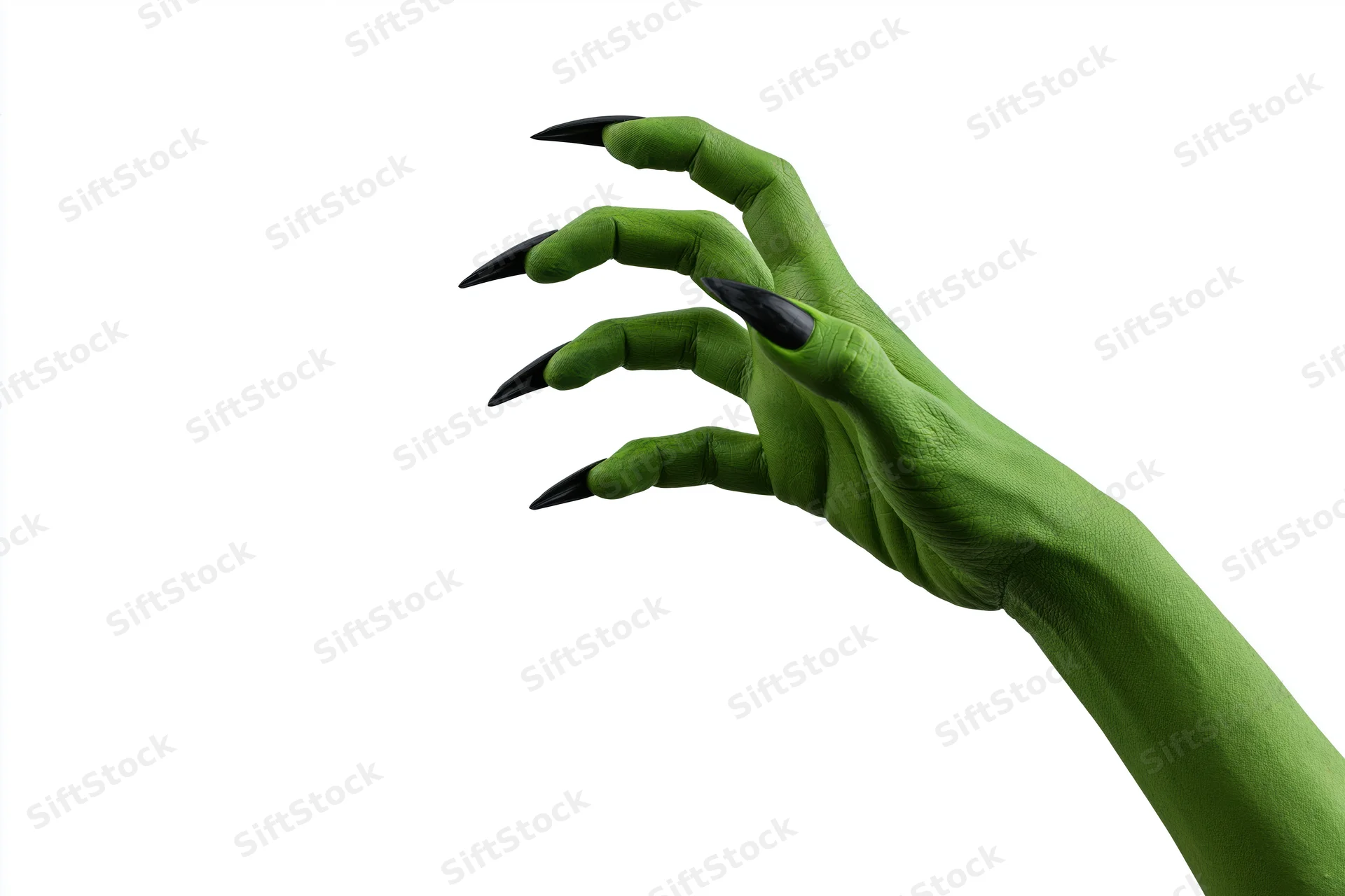 Green-painted hand with long black claws reaching out against white background