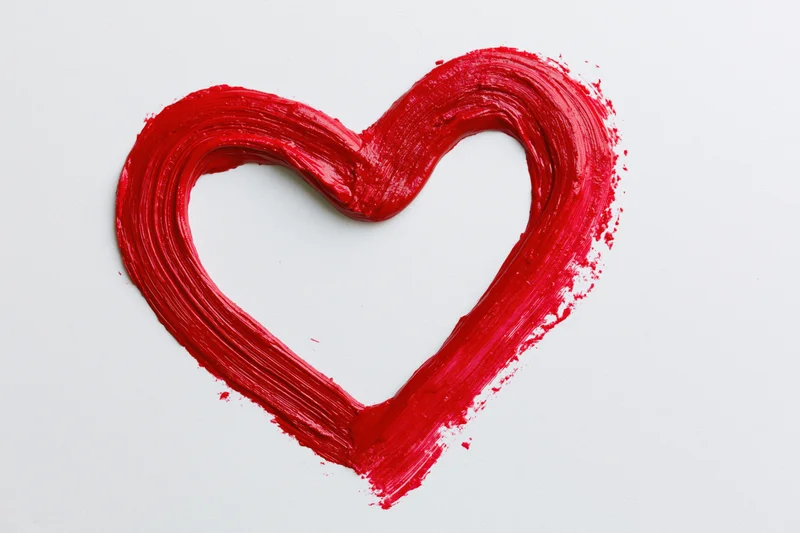 Red heart outline painted with thick brushstrokes on white background