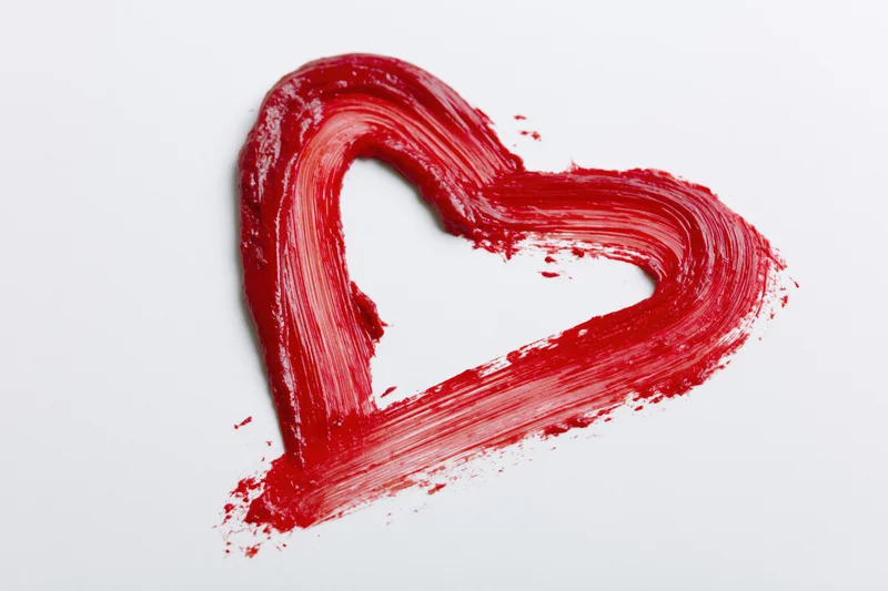 Red heart outline painted with thick brushstrokes on white background