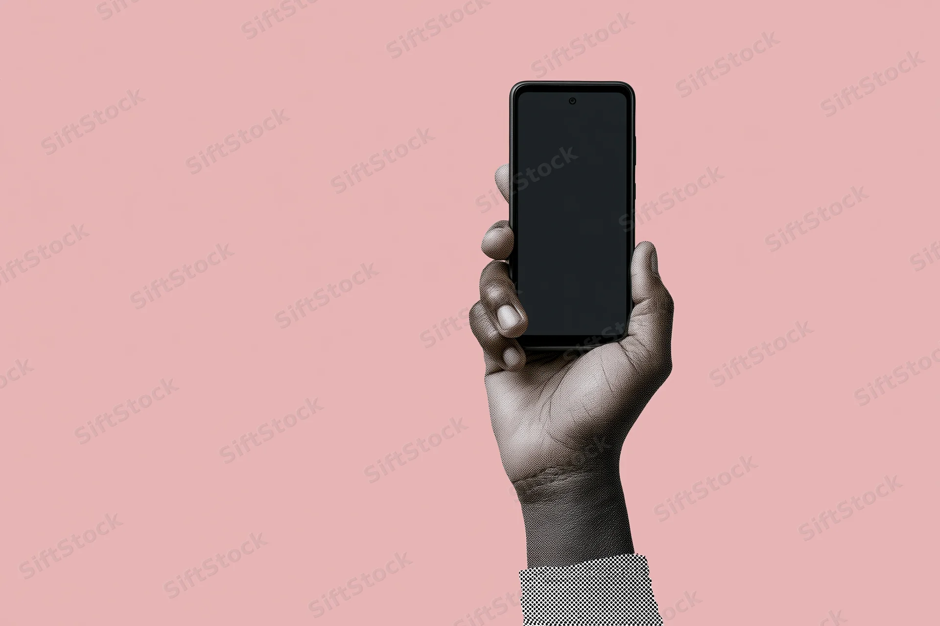 Hand holding black smartphone with blank screen against pink background
