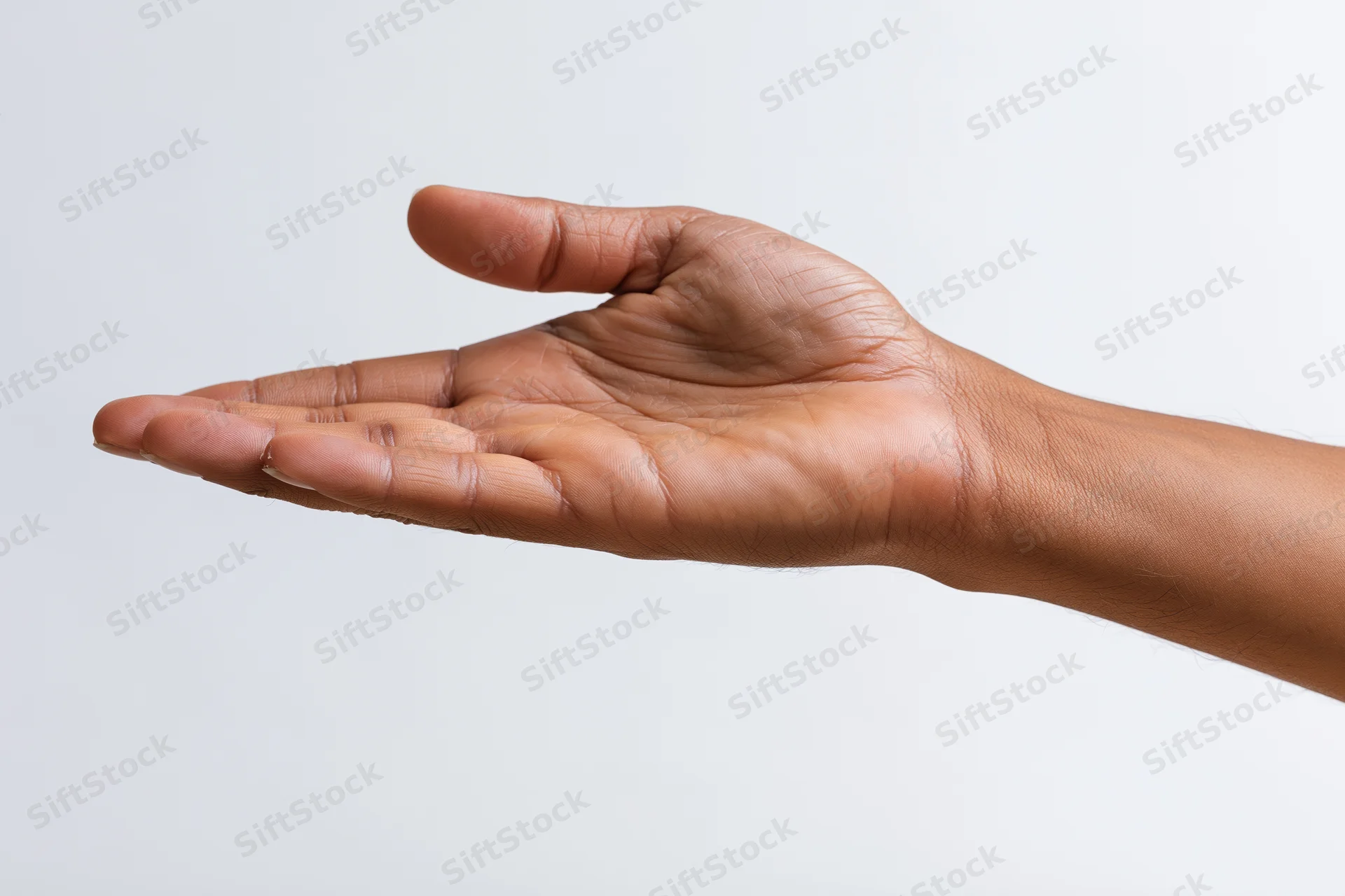 Open hand gesture with palm facing up against white background