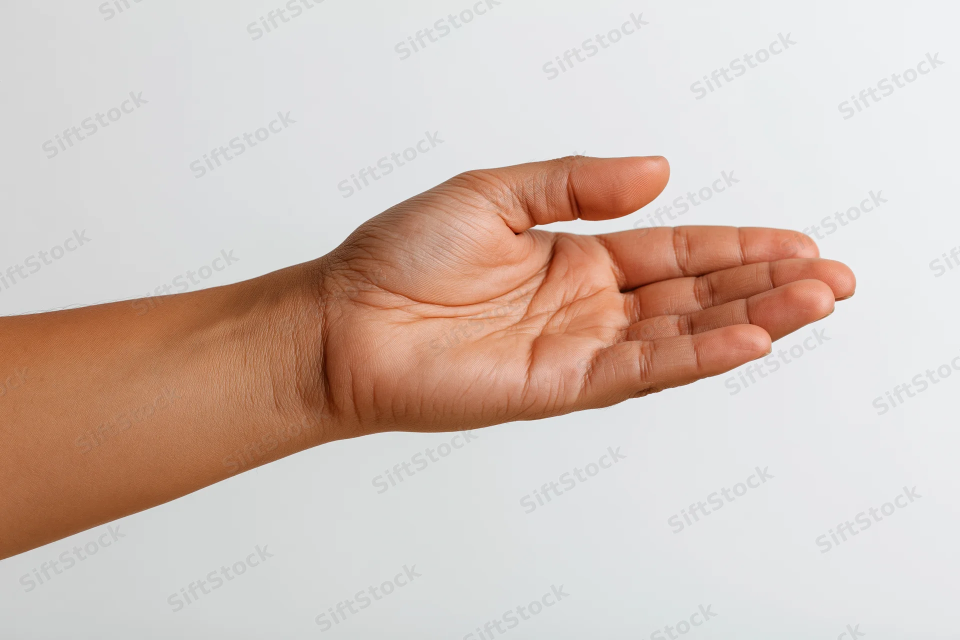 Open hand gesture with forearm extended against white background