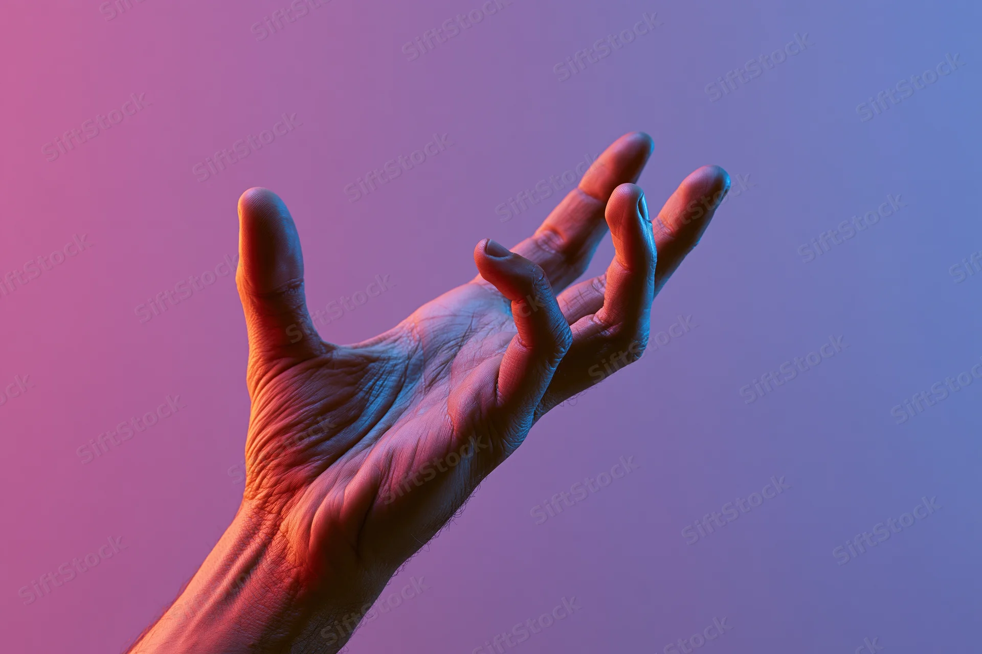 Hand reaching upward with fingers slightly curved against a gradient background