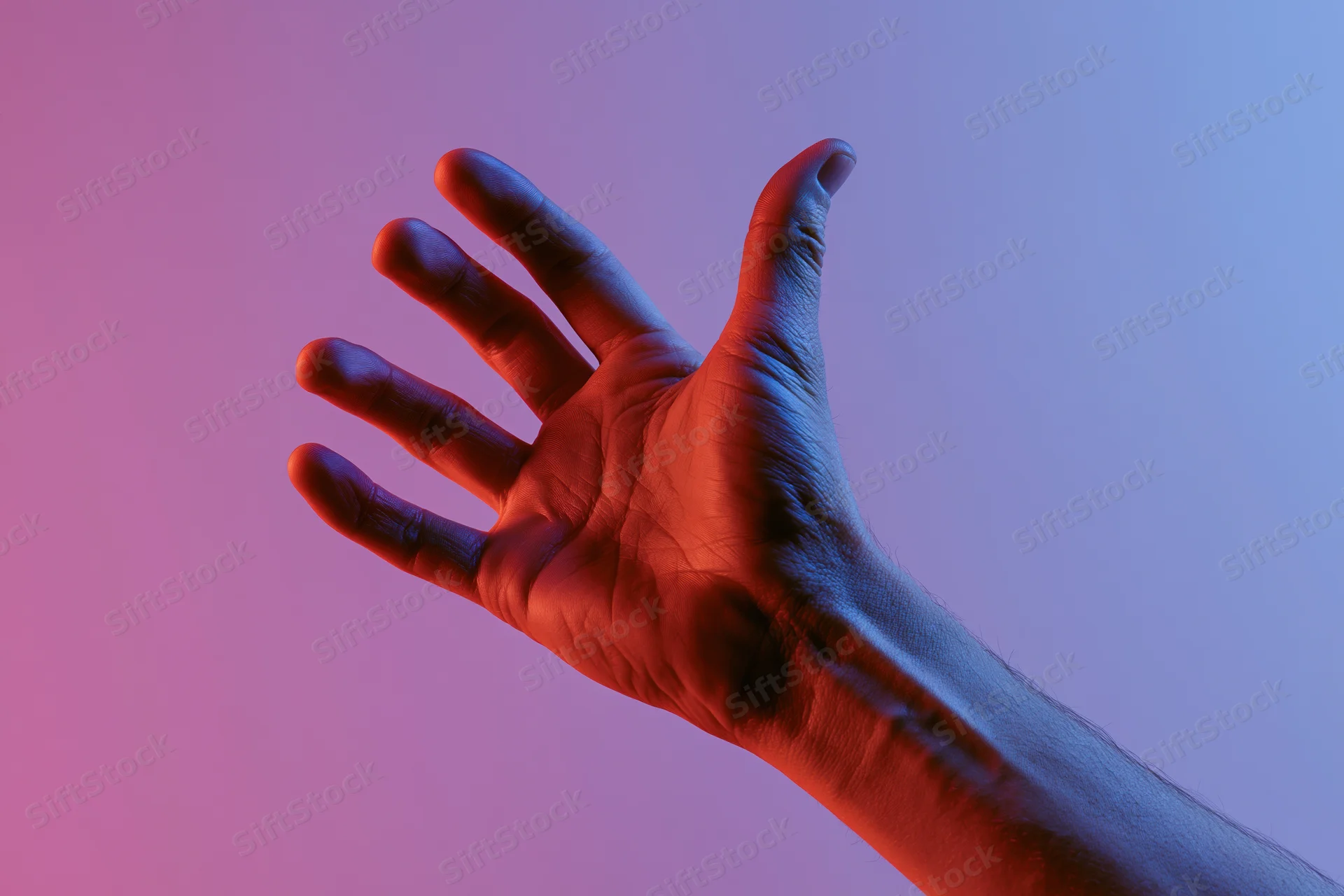 Hand reaching upward with fingers extended against a pink and purple gradient background