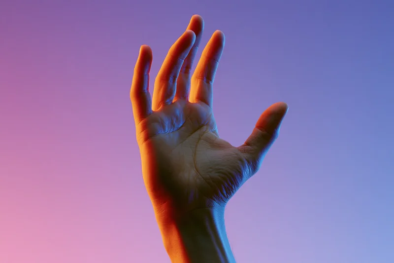 Hand reaching upward against a pink and purple gradient background