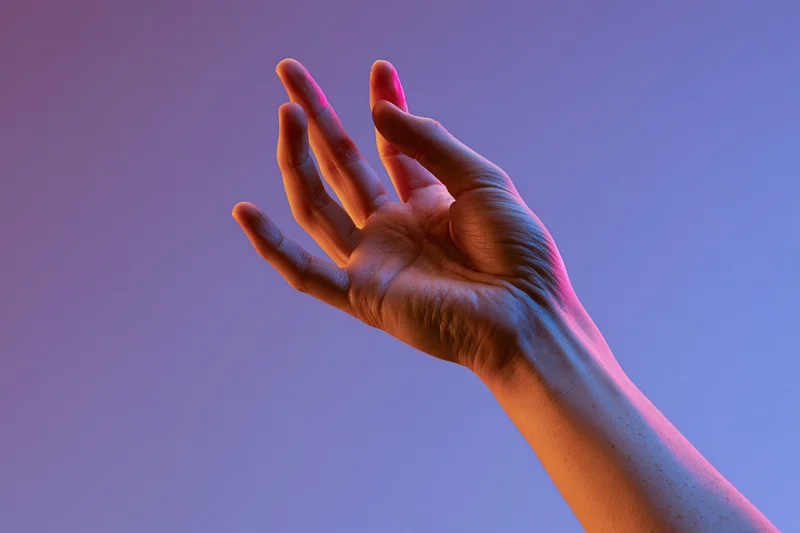 Hand reaching upward with fingers extended against a purple and pink gradient background