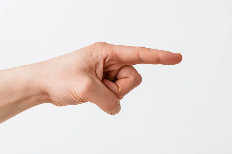 Hand with index finger extended pointing to the side against white background