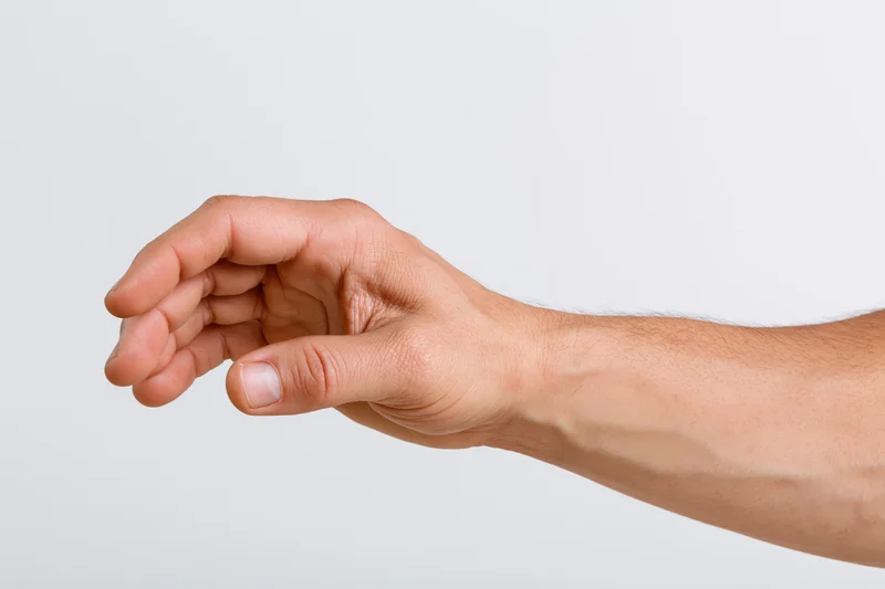 Male hand making a gentle grasping gesture against white background