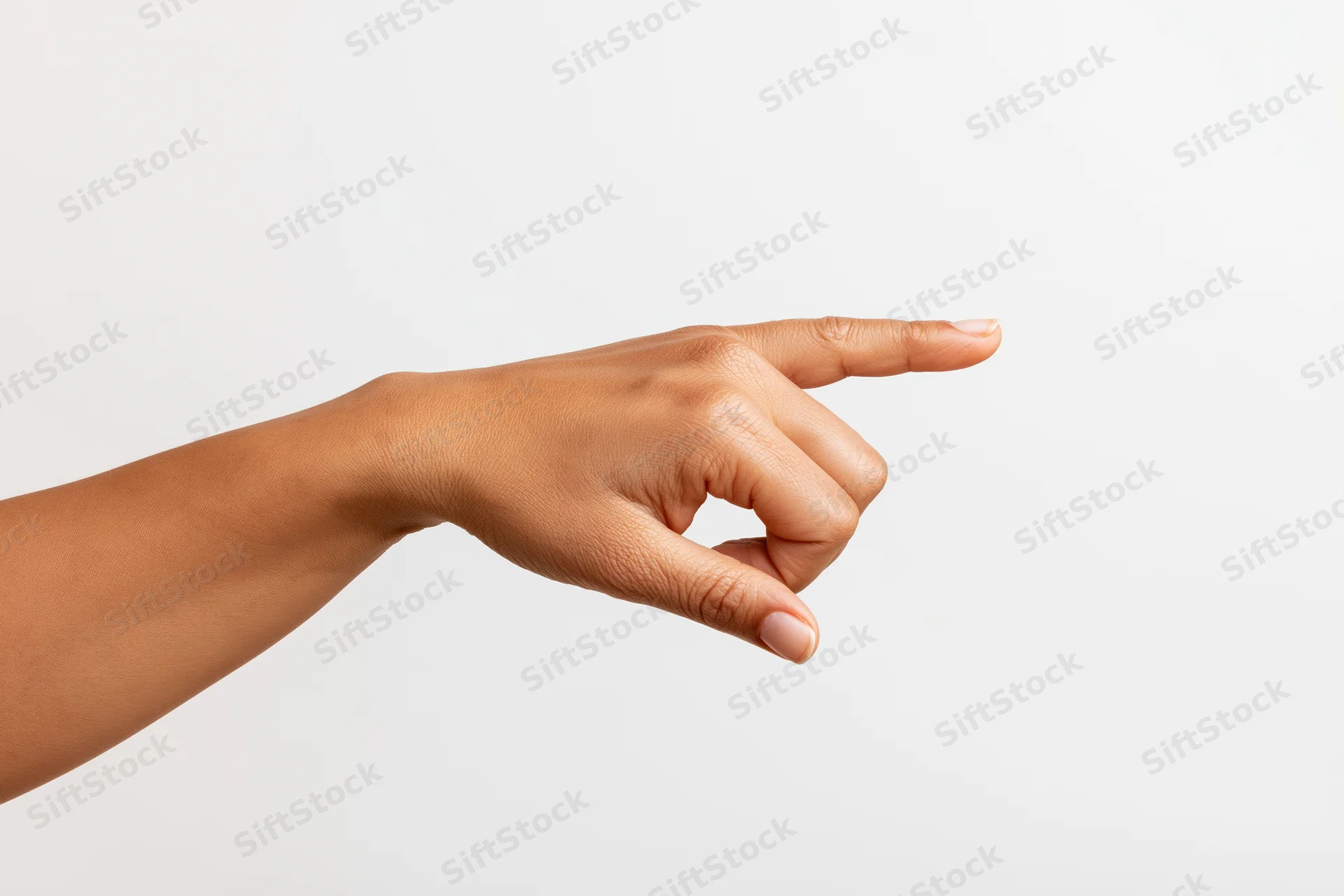 Woman's hand pointing with index finger extended against white background