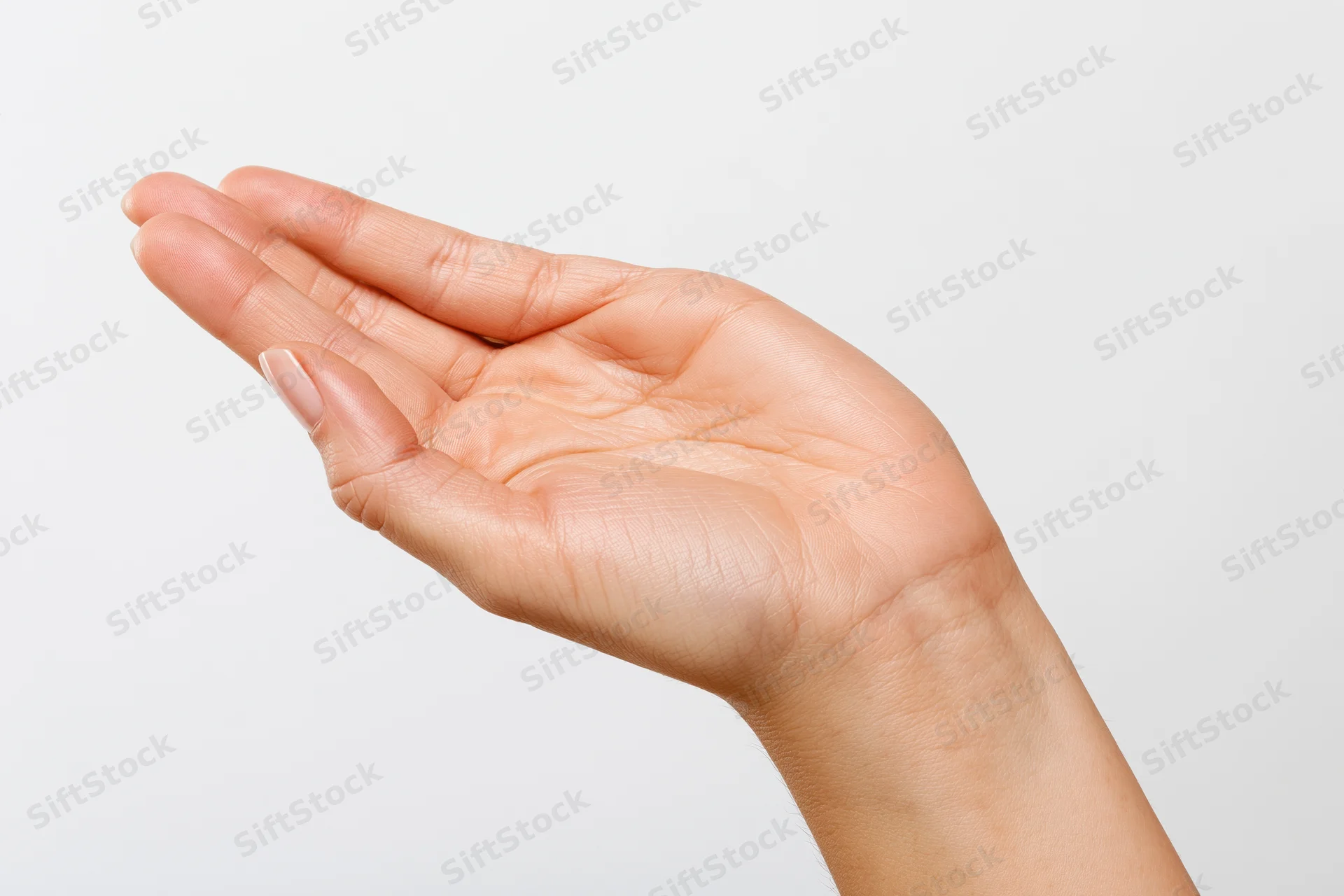 Woman's hand in open palm gesture against white background