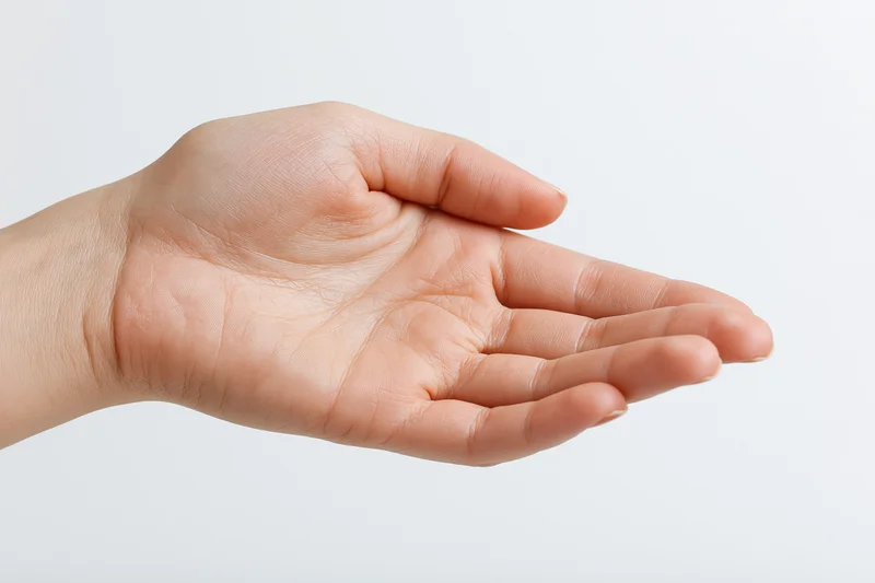 Woman's hand in open palm gesture against white background