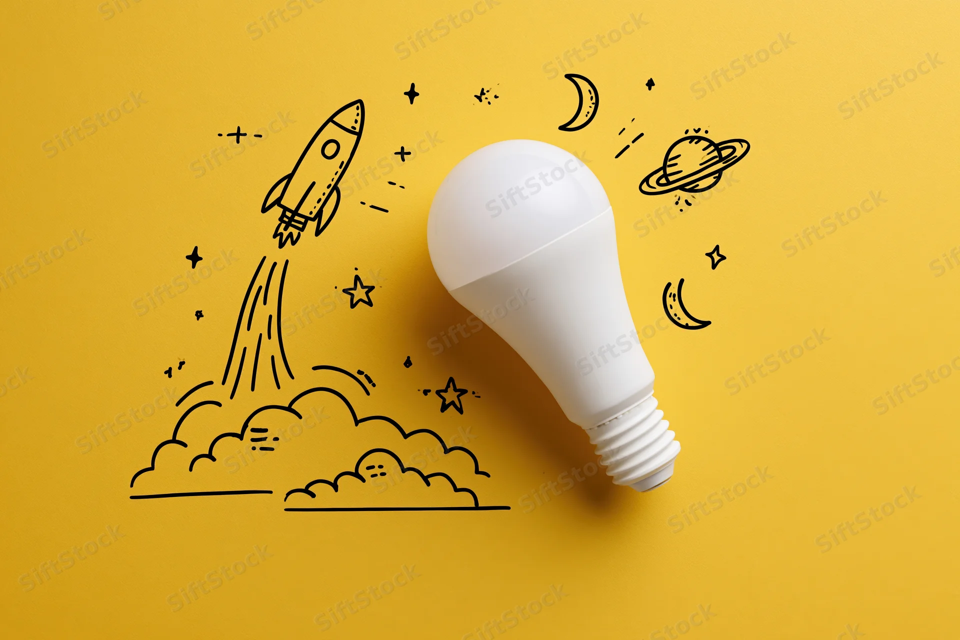White led lightbulb on yellow background with rocket and space doodles