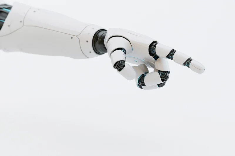 Robotic arm extending forward with one finger pointing against white background