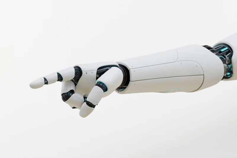 Robotic arm with extended finger pointing forward against white background