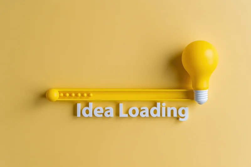 Yellow lightbulb beside horizontal progress bar with idea loading text on plain background