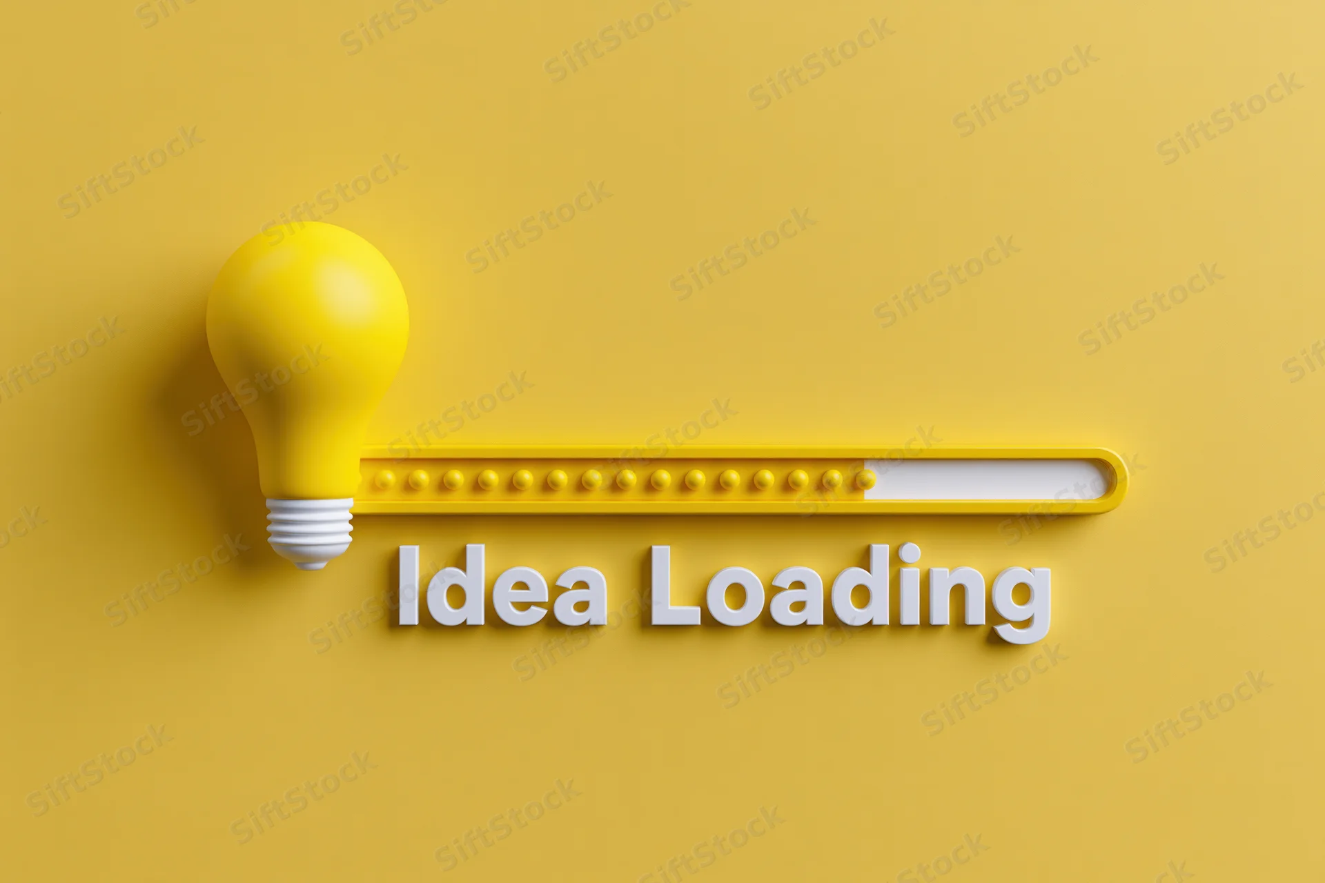 Yellow lightbulb beside horizontal loading bar with idea loading text on yellow background