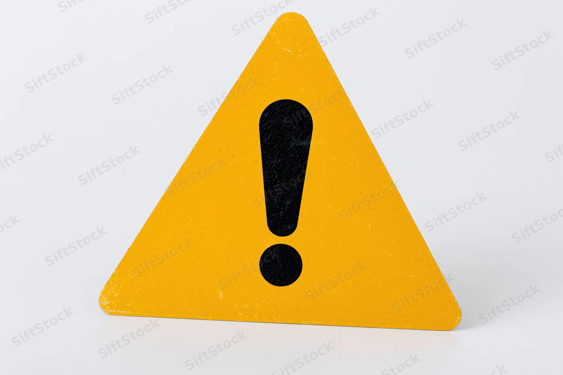 Yellow triangular warning sign with black exclamation mark on white background