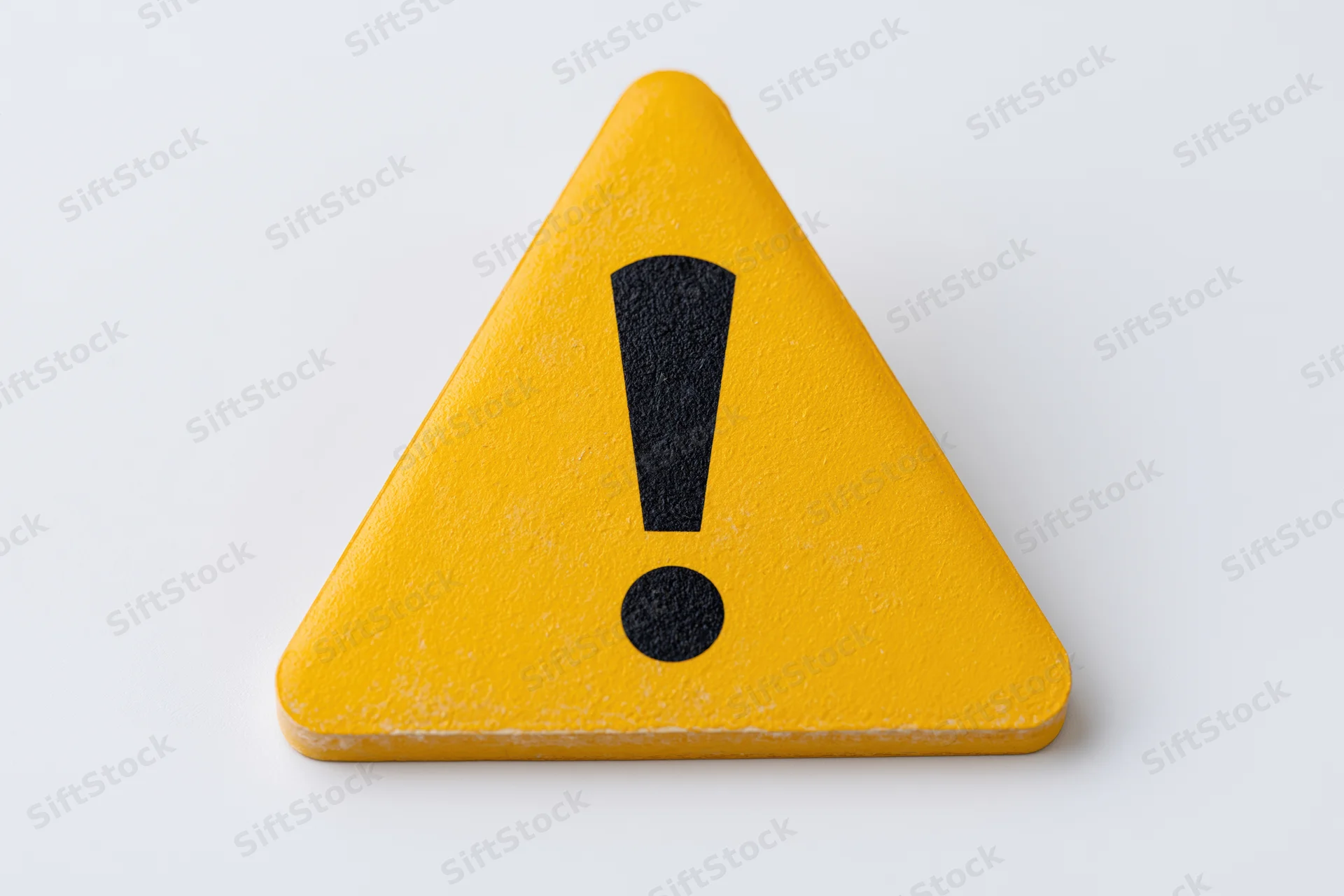Yellow triangular warning sign with black exclamation mark on white background