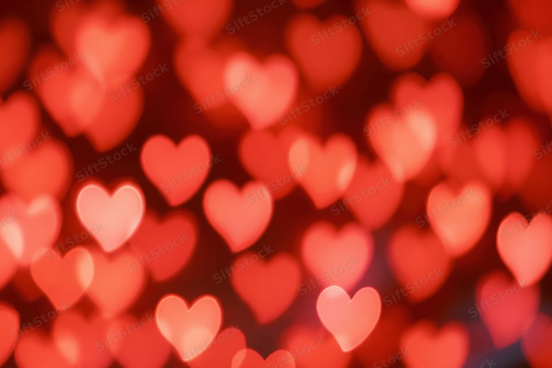 Soft out-of-focus heart-shaped lights forming a romantic bokeh background