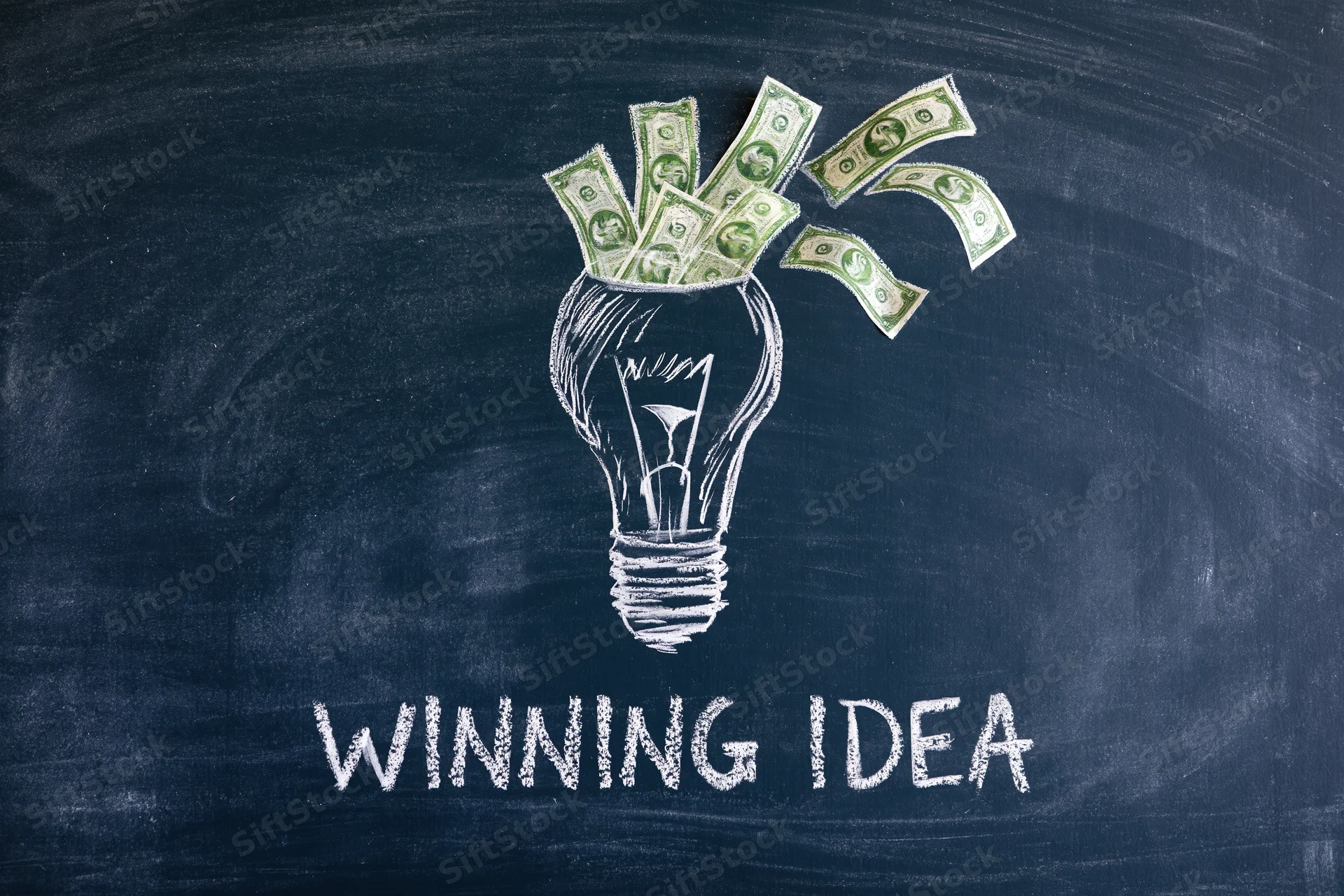 Chalk drawing of a lightbulb filled with dollar bills on a dark navy blackboard with the words winning idea written below
