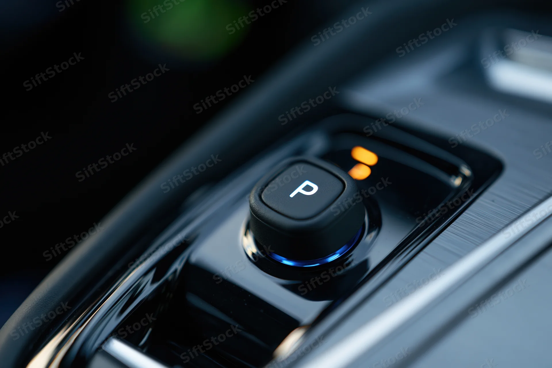 Close-up of electronic gear selector button in modern car console