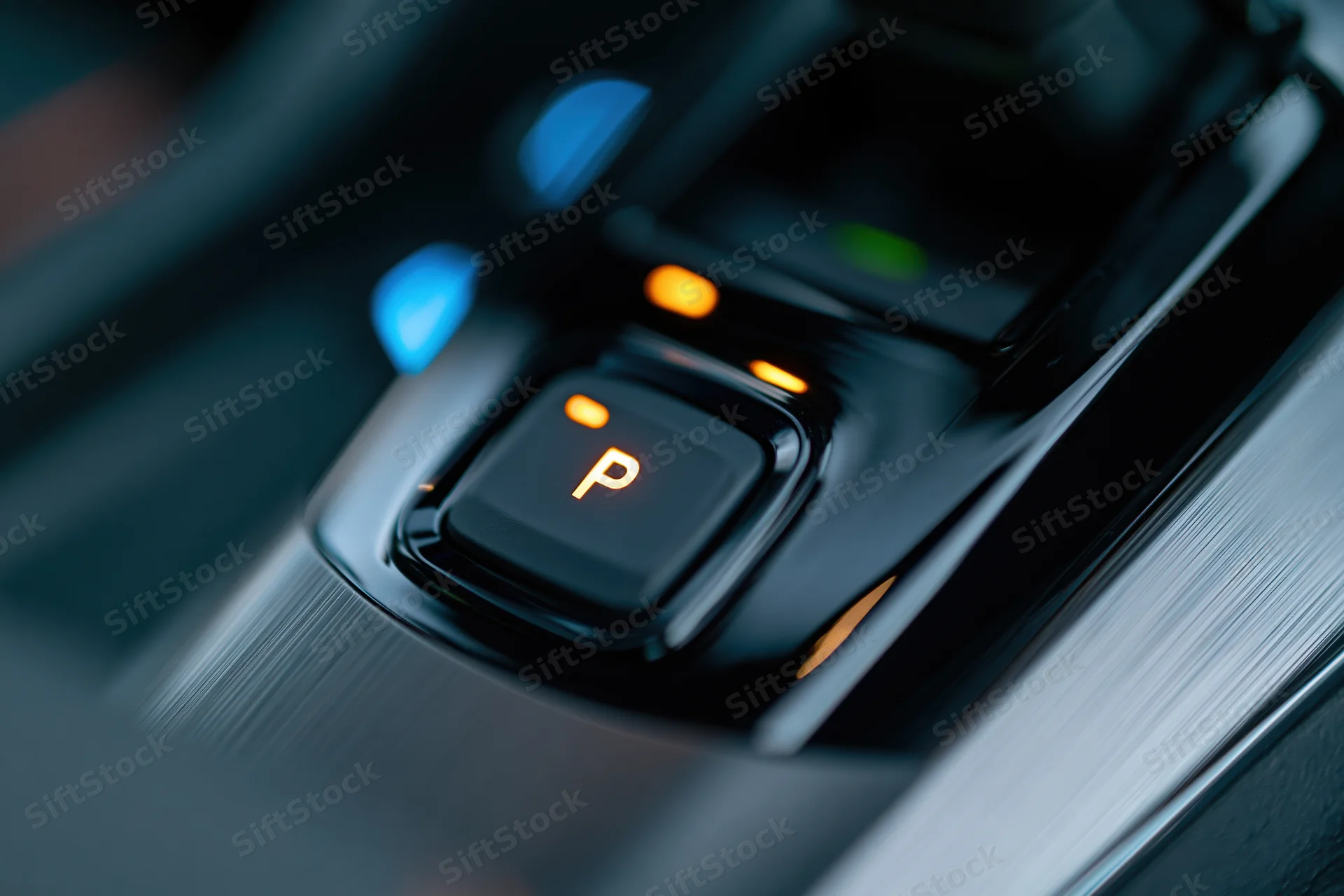 Illuminated electronic gear selector in a modern car interior