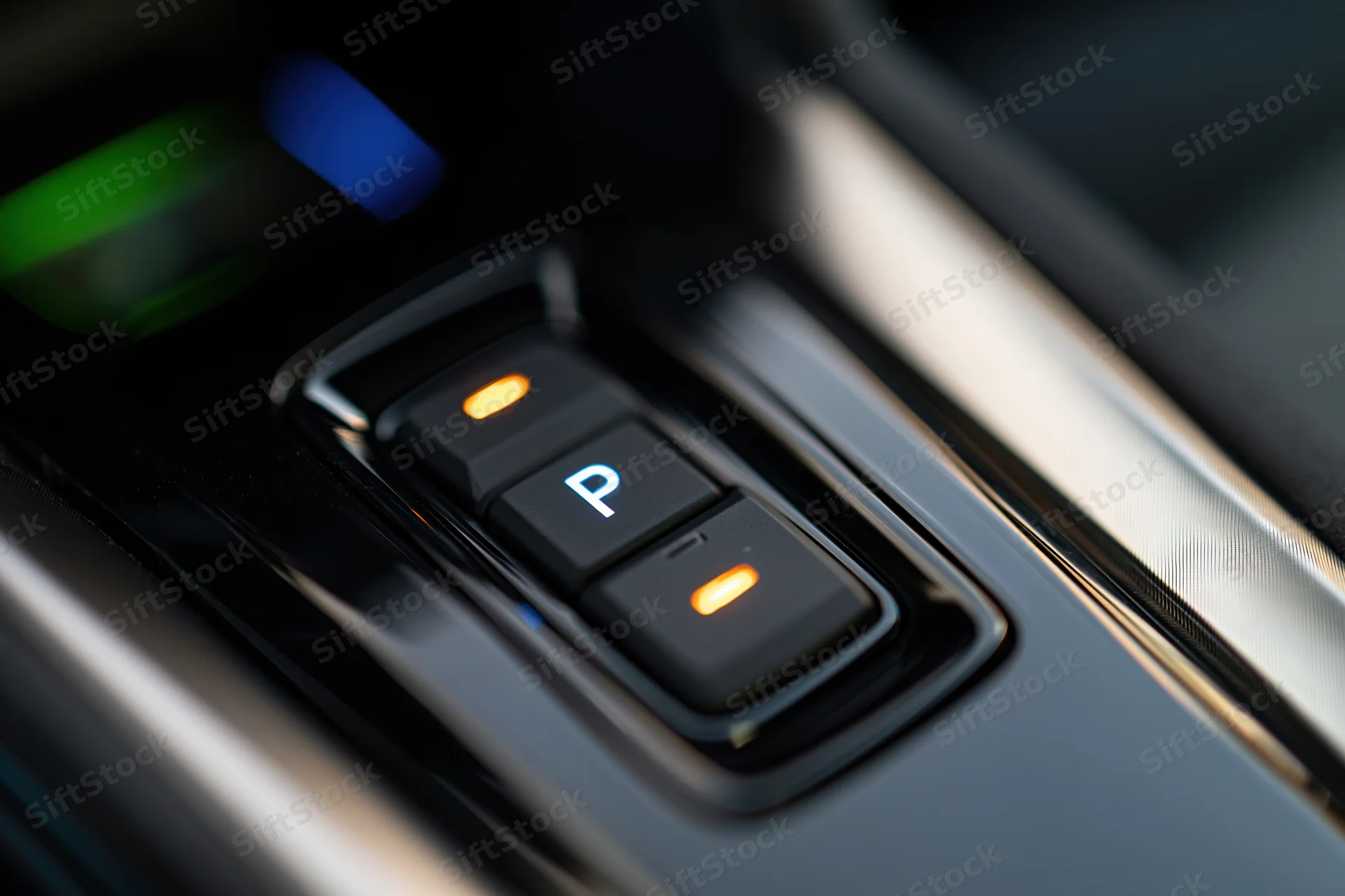 Close-up of electronic gear selector buttons in a modern car interior