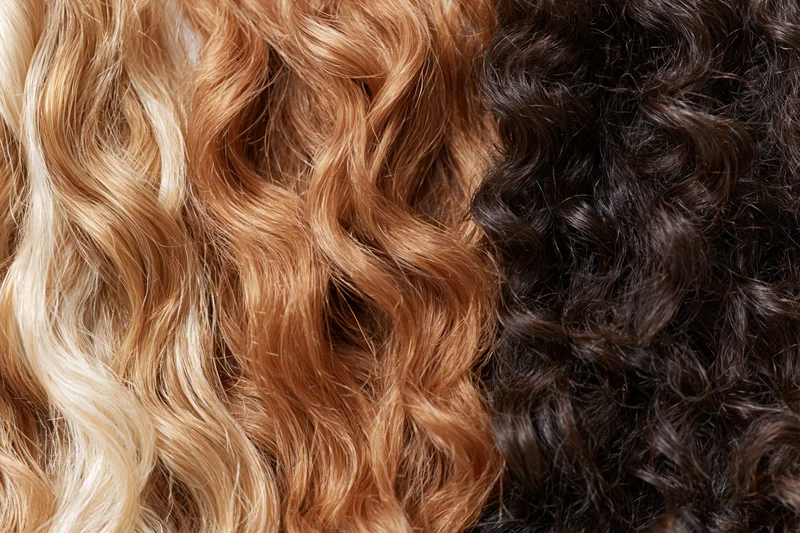 Close-up of three hair texture samples arranged side by side