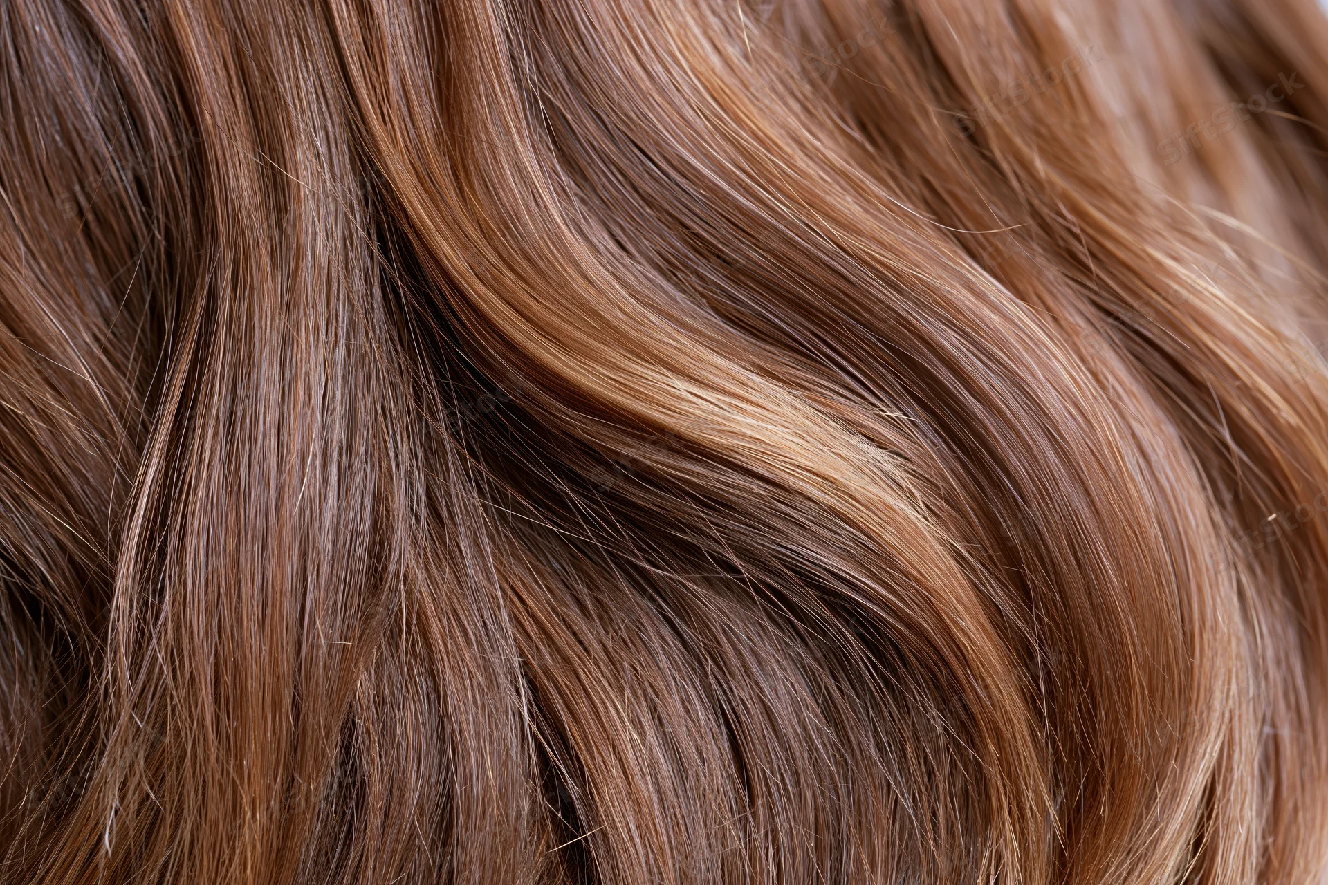 Flowing medium-brown hair in extreme closeup showing texture and shine