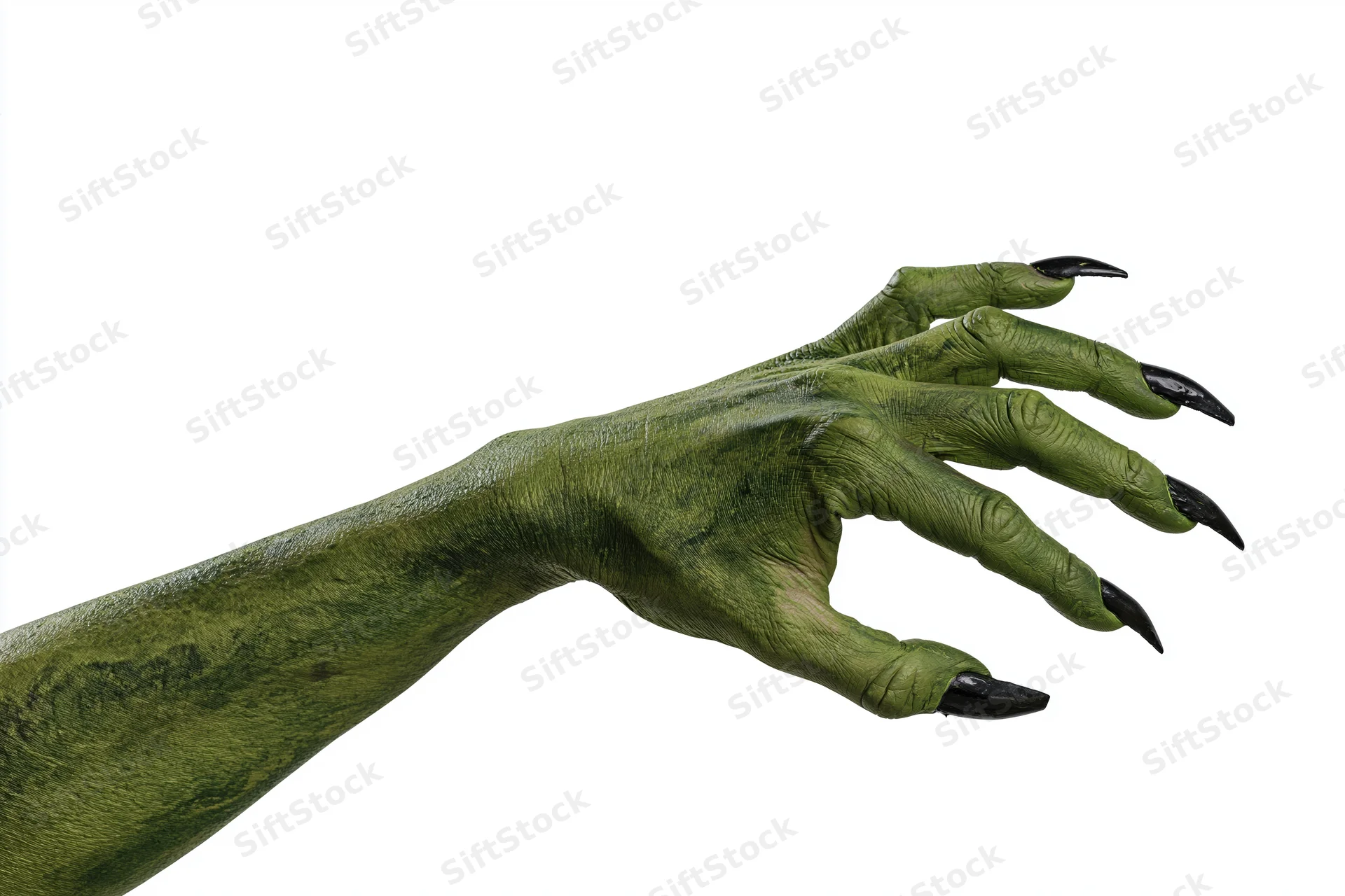Green-painted monster hand with black claws reaching forward isolated on white background