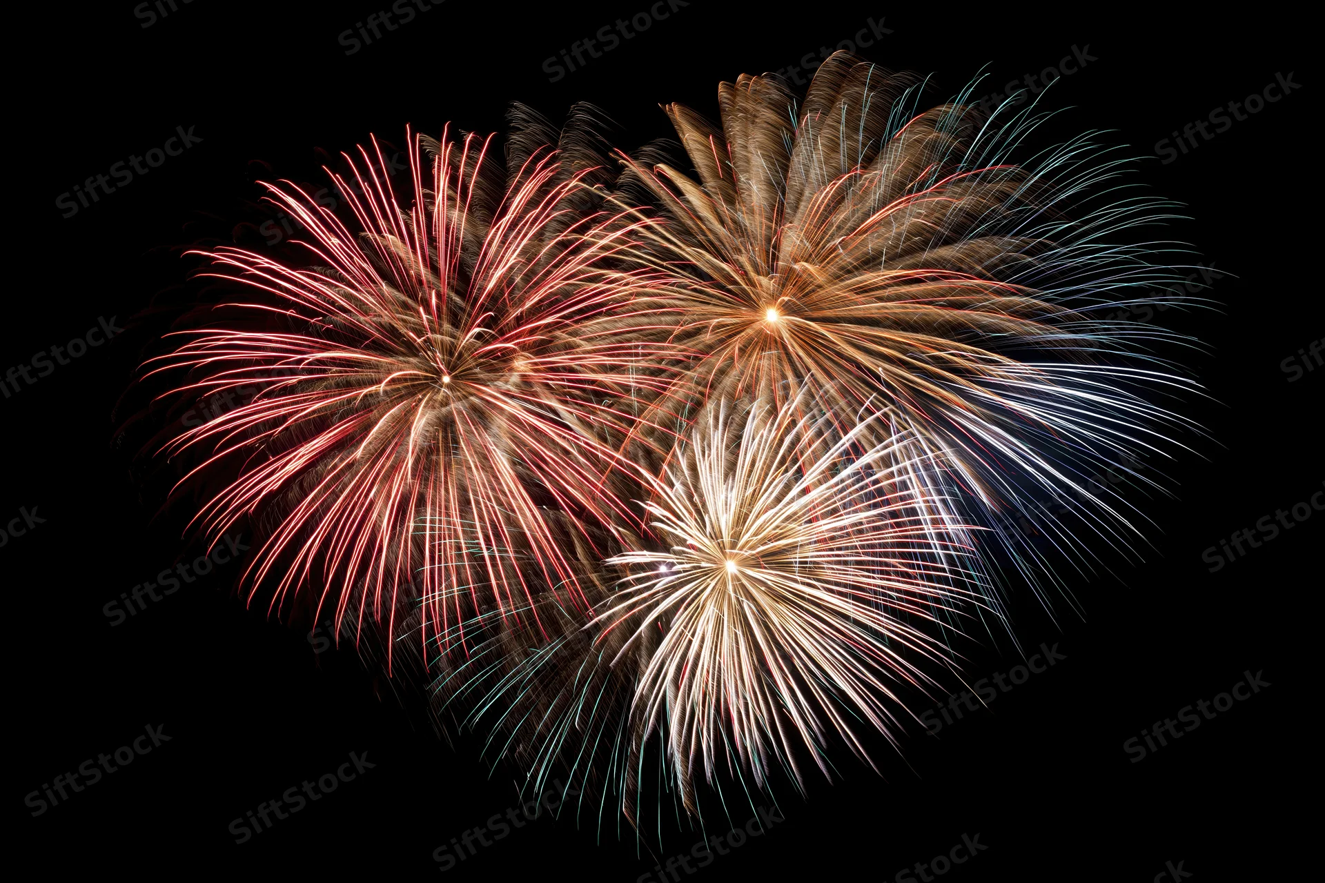 Fireworks bursting in a heart-shaped pattern against a dark night sky