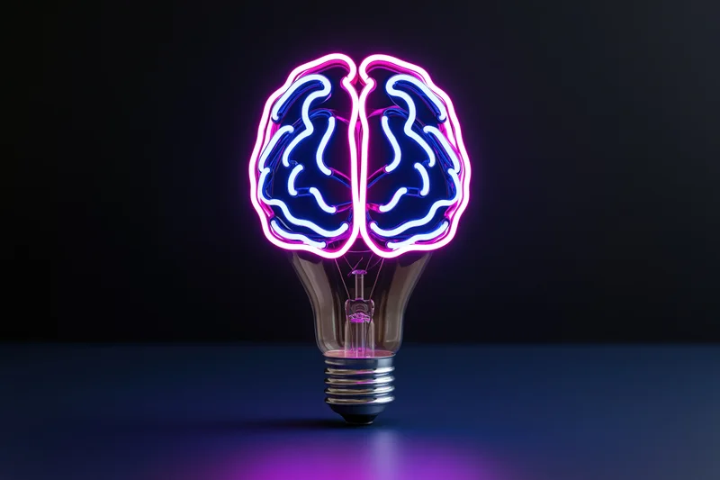 Neon brain-shaped lightbulb glowing with purple and blue light on dark surface