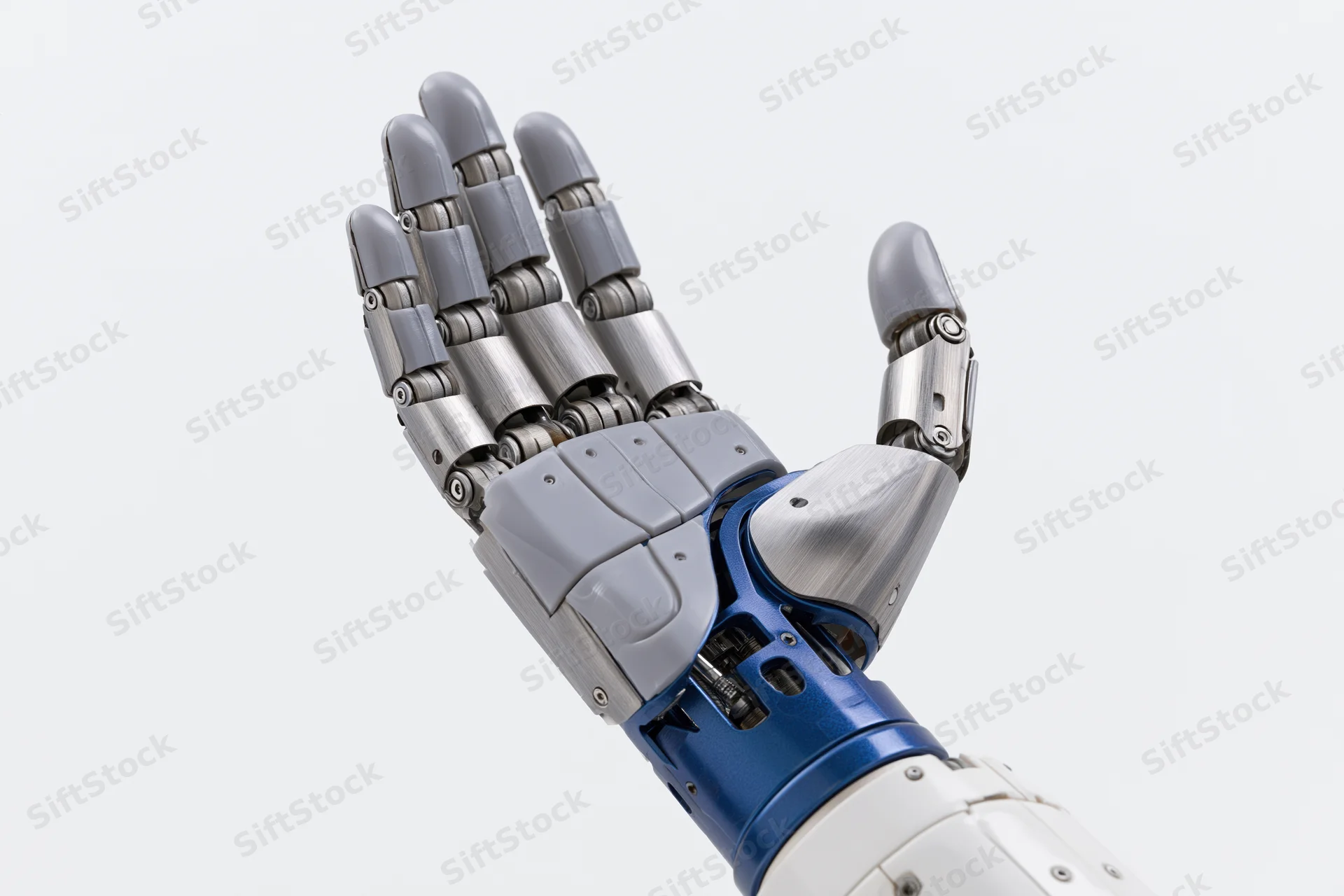 Robotic prosthetic hand raised with open palm against white background