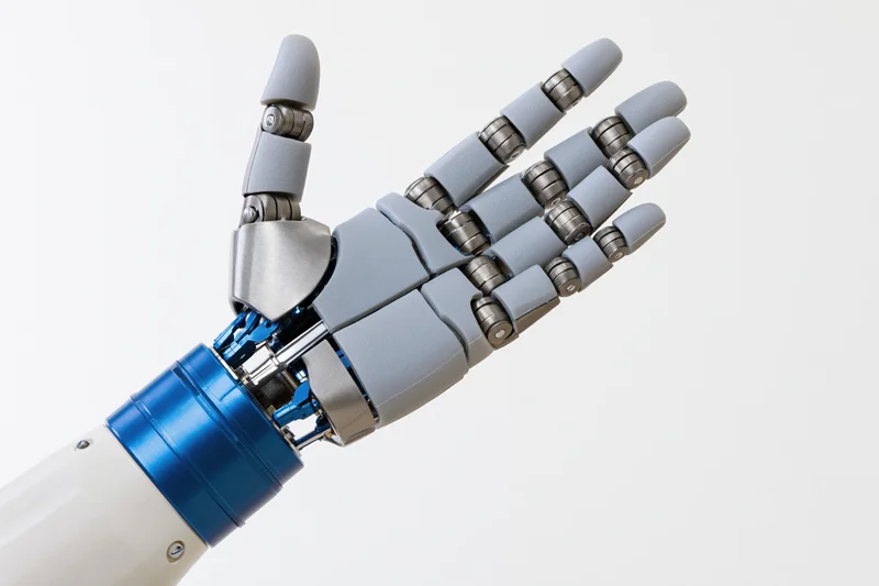 Robotic prosthetic hand with open palm facing forward isolated on white background