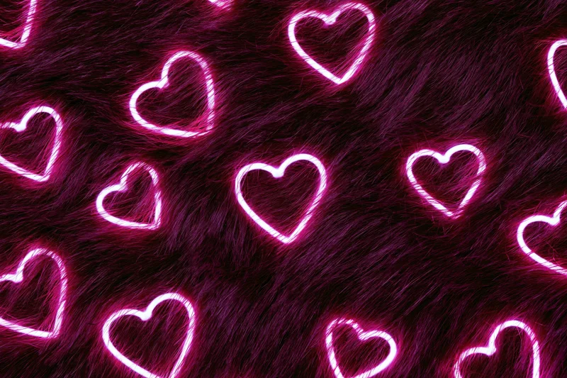 Glowing neon pink heart outlines scattered across a dark purple furry surface