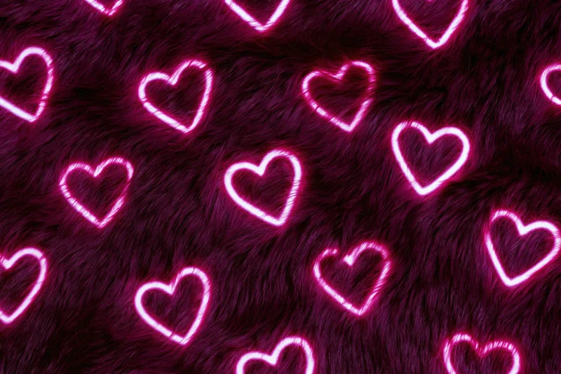 Glowing neon pink heart outlines scattered across a dark purple furry surface