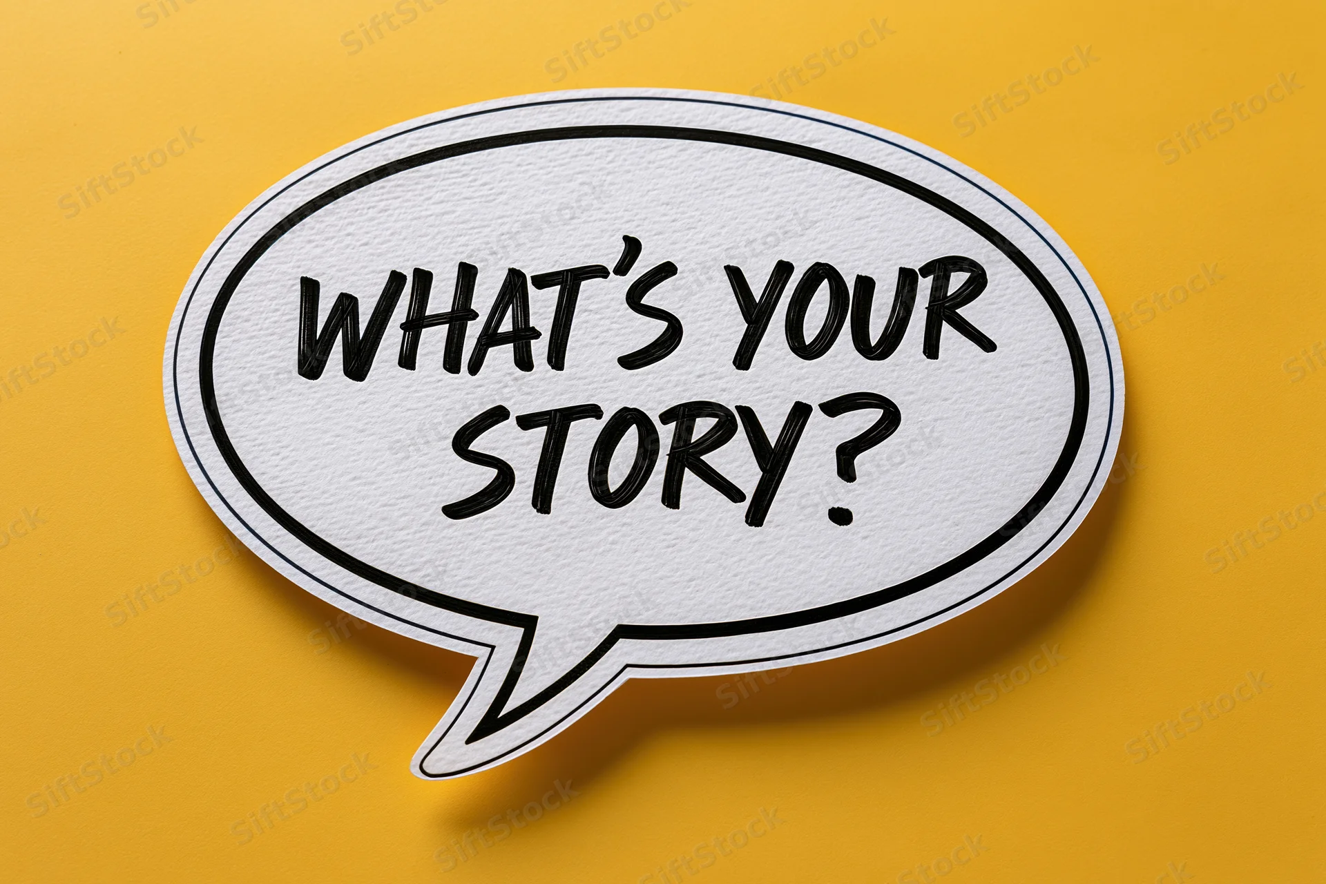 White speech bubble with bold black handwritten text reading what's your story on yellow background