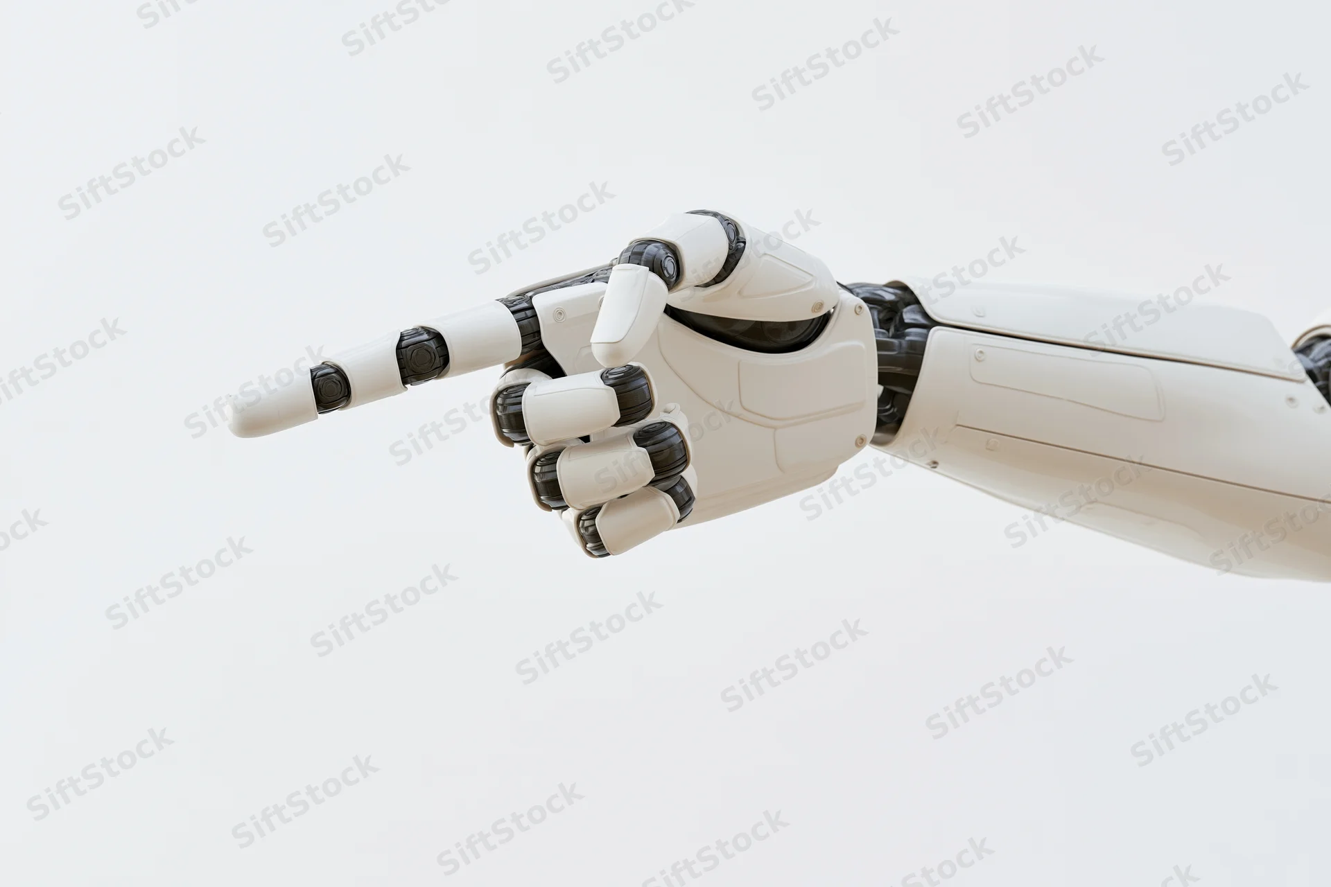 Robotic hand pointing forward against white background