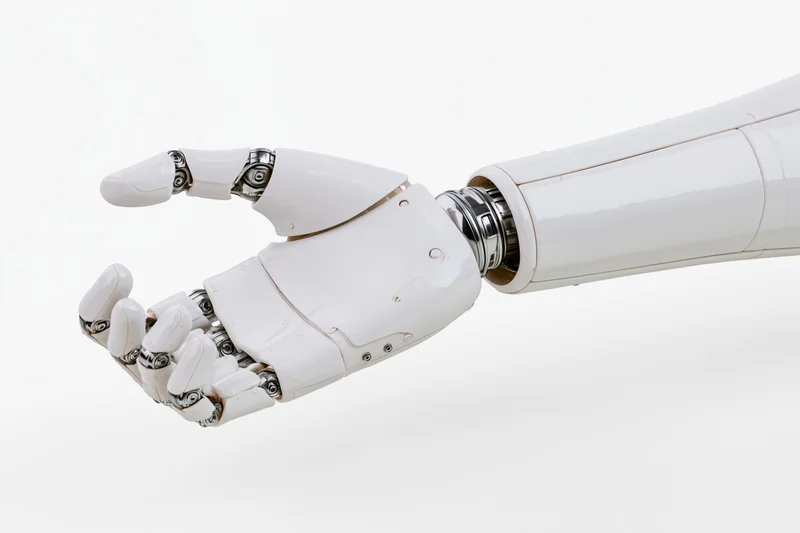 White robotic hand and forearm with fingers slightly curled against plain background