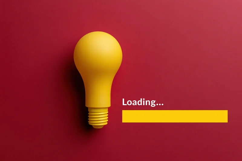 Yellow plastic lightbulb beside loading progress bar on red background