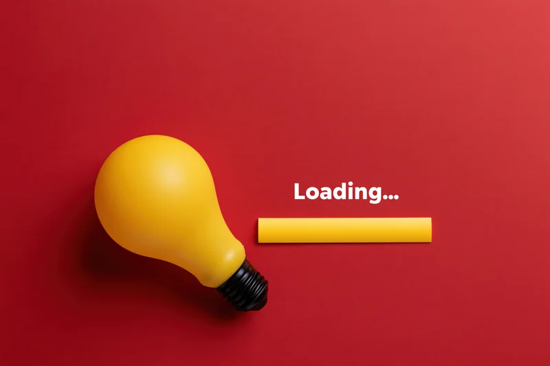 Yellow plastic lightbulb with loading text and progress bar on red background