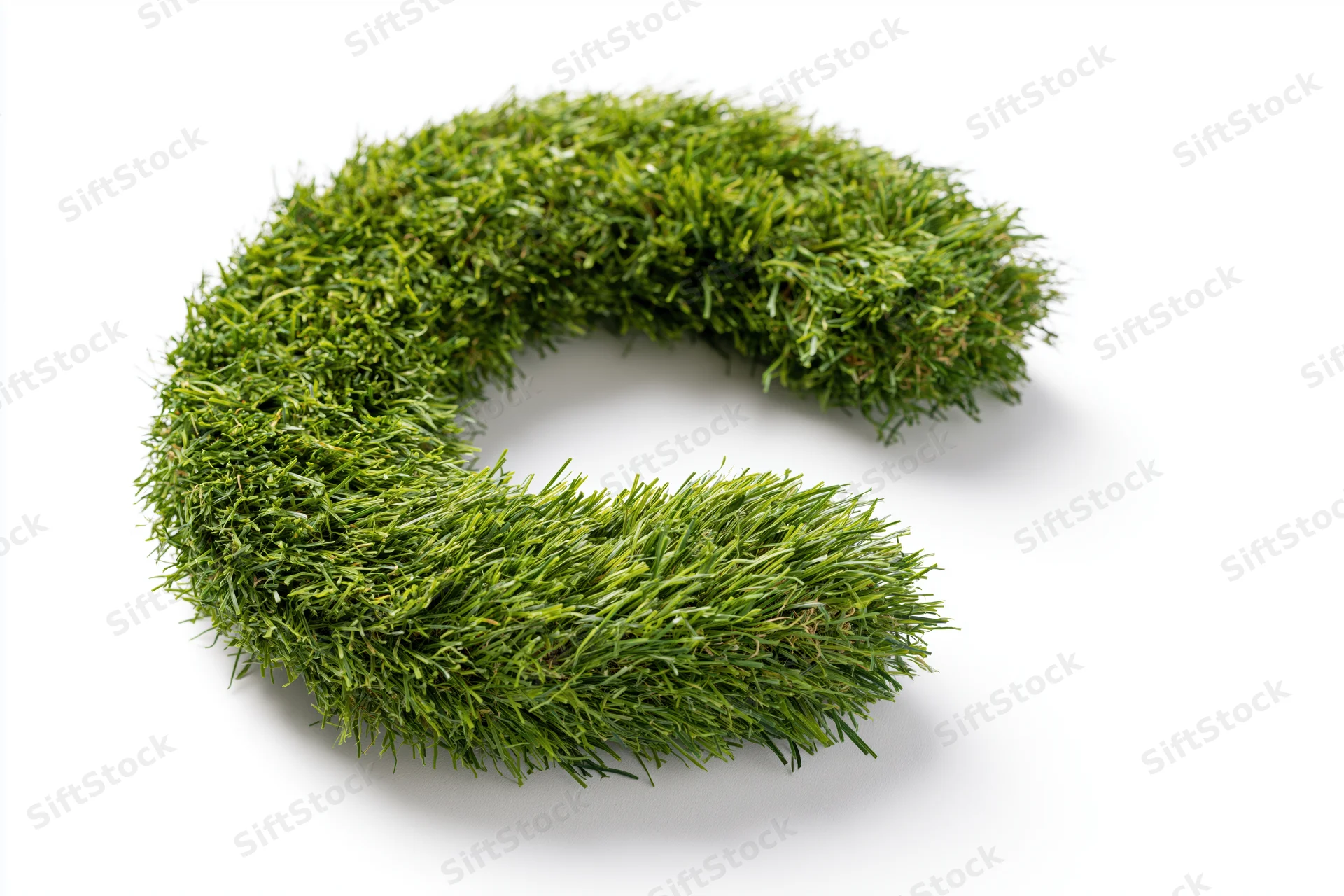 Grass formed into a bold letter c shape on white background