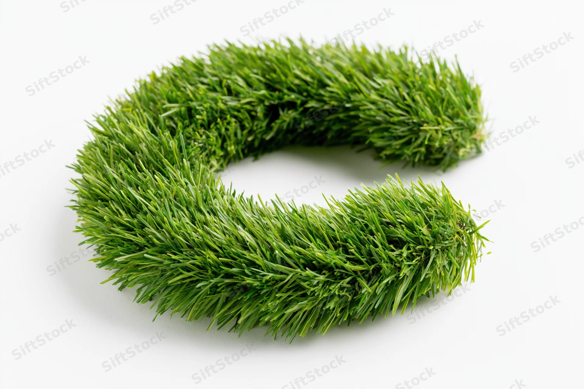A bold letter c shape made of dense green grass blades on a white background