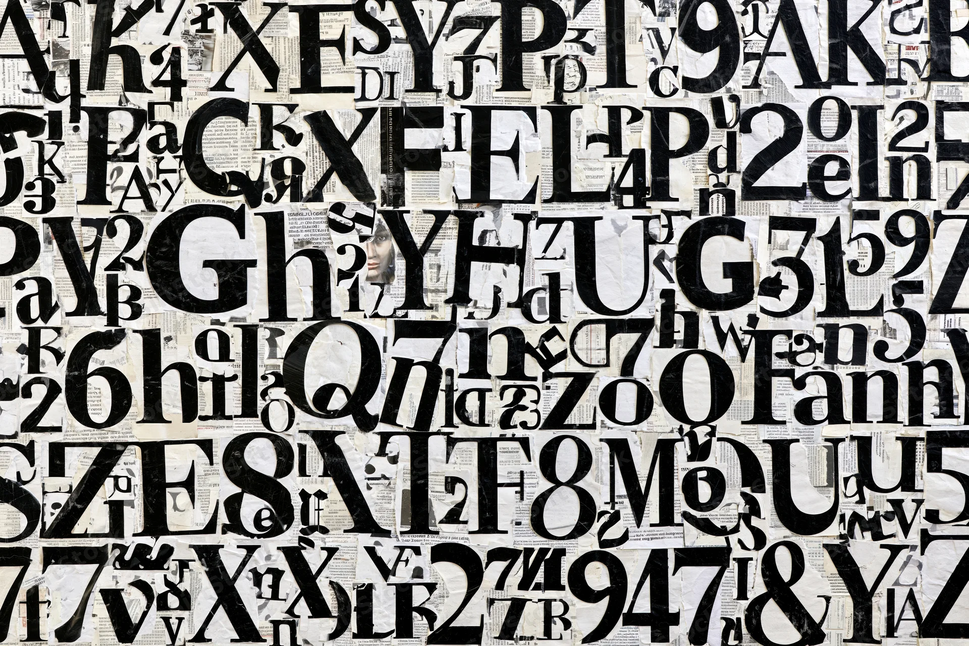 Dense collage of cut-out letters and numbers arranged on paper background