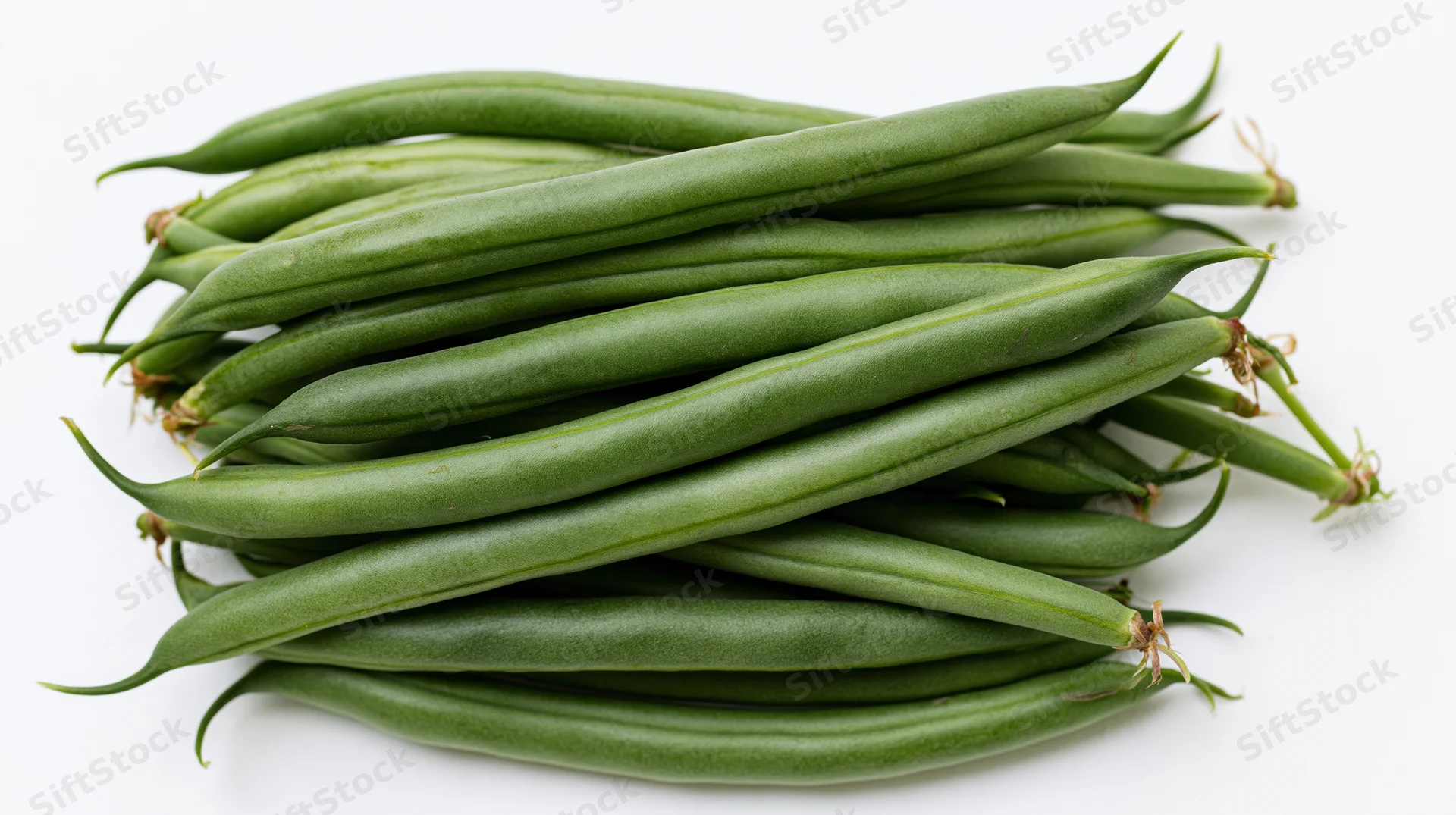 Pile of fresh raw green beans stacked horizontally on white background