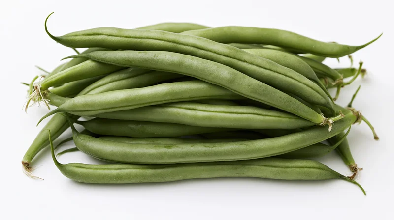Pile of fresh raw green beans stacked horizontally on white background