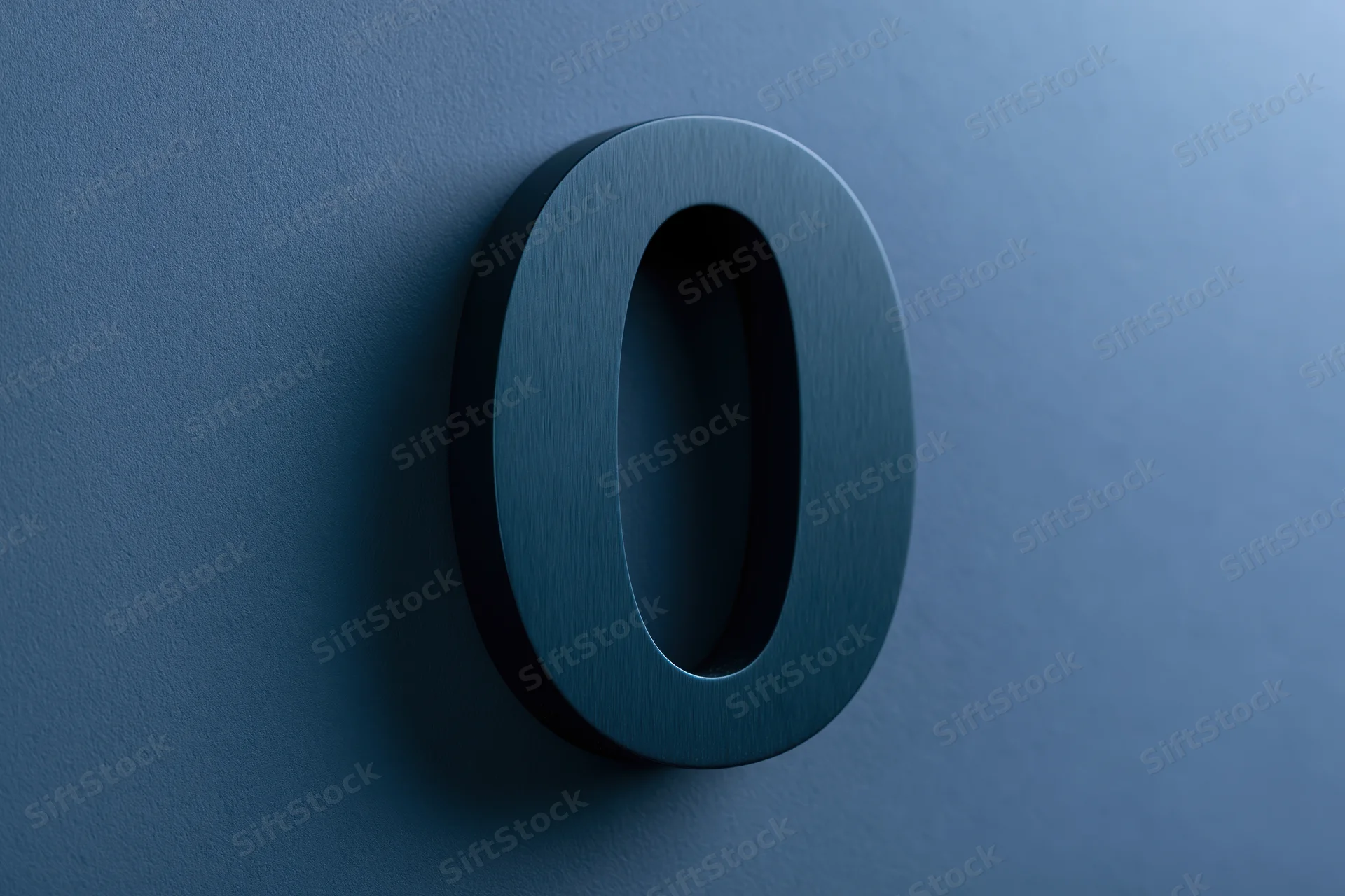 Three-dimensional matte dark teal zero mounted on a textured blue wall
