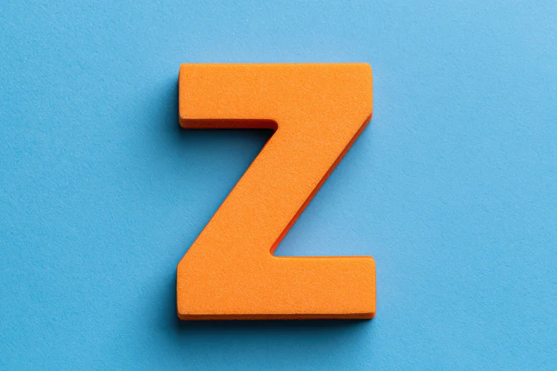 Orange foam letter z centered on bright blue background