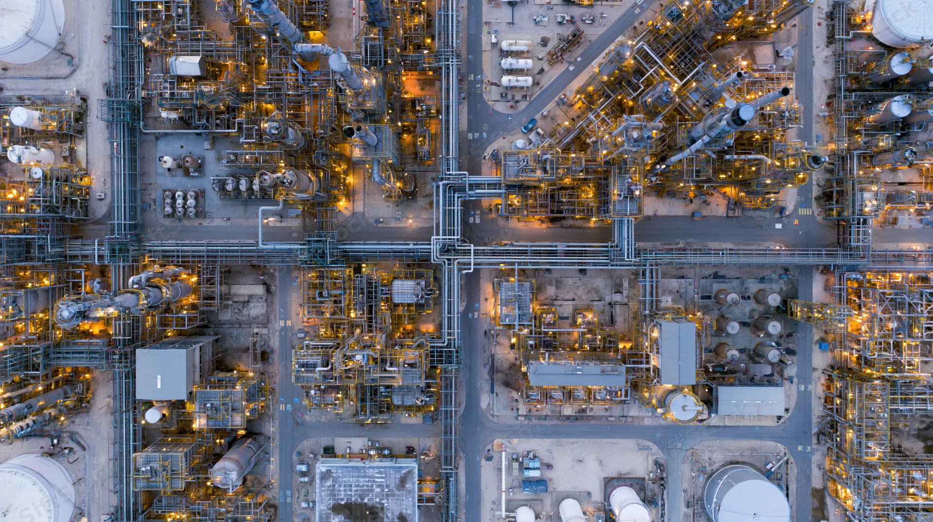 Aerial top-down view of a large oil refinery and petrochemical plant at night