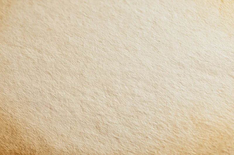 Aged cream paper texture filling the frame in a flat lay view